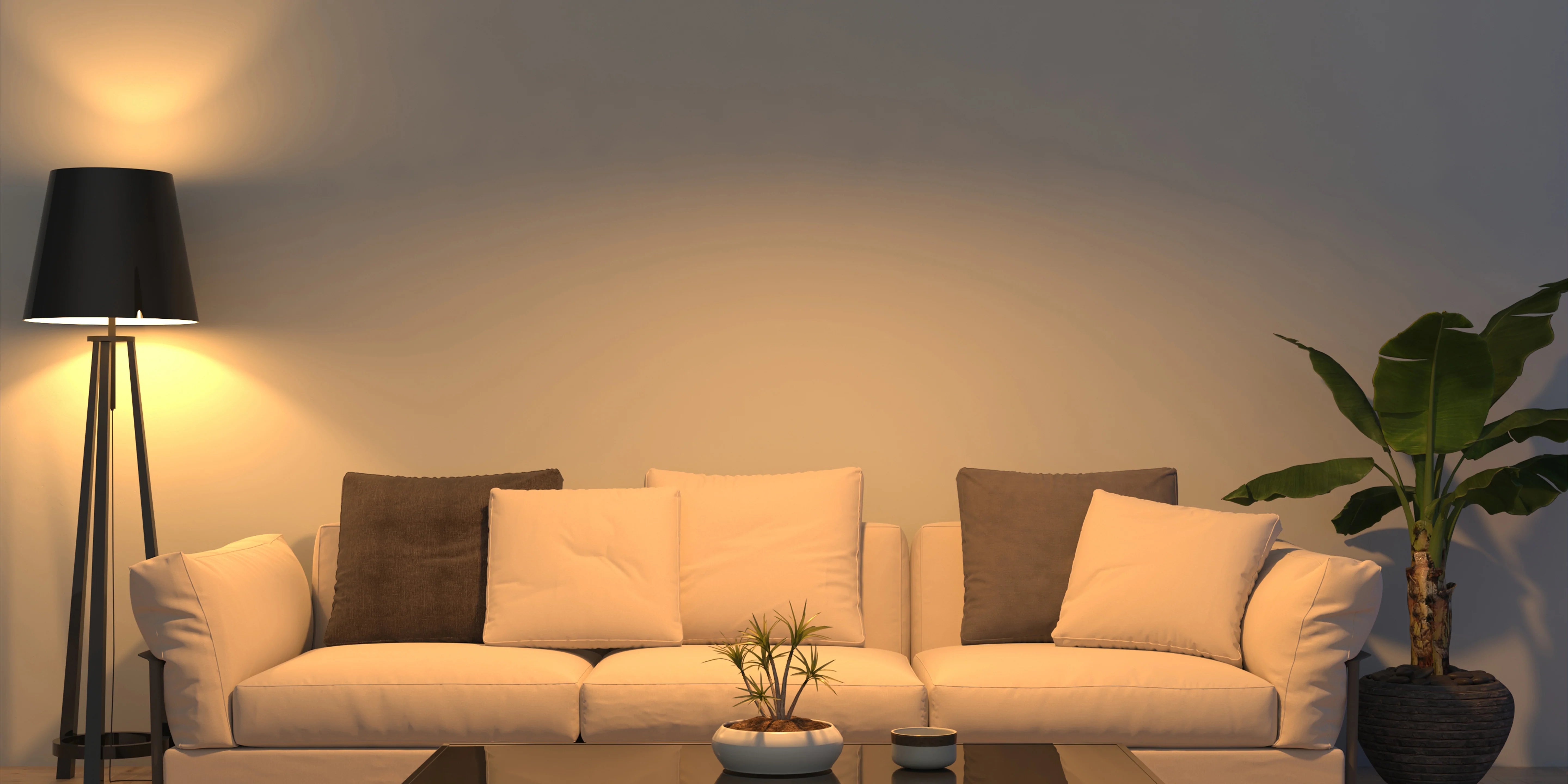living room featuring a comfortable couch, a stylish lamp, and a modern table, creating a welcoming atmosphere