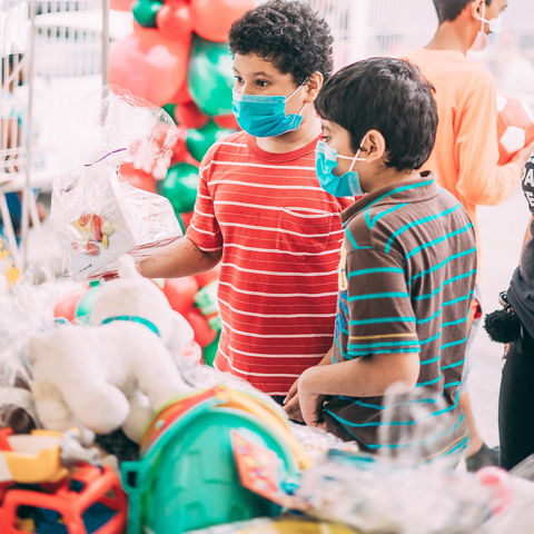 little boys receive gifts at toy drive