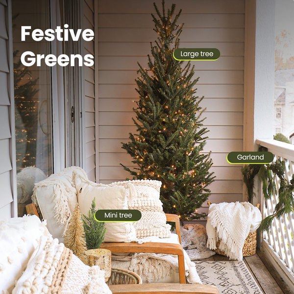 Natural Christmas tree and garland in a festive balcony space.